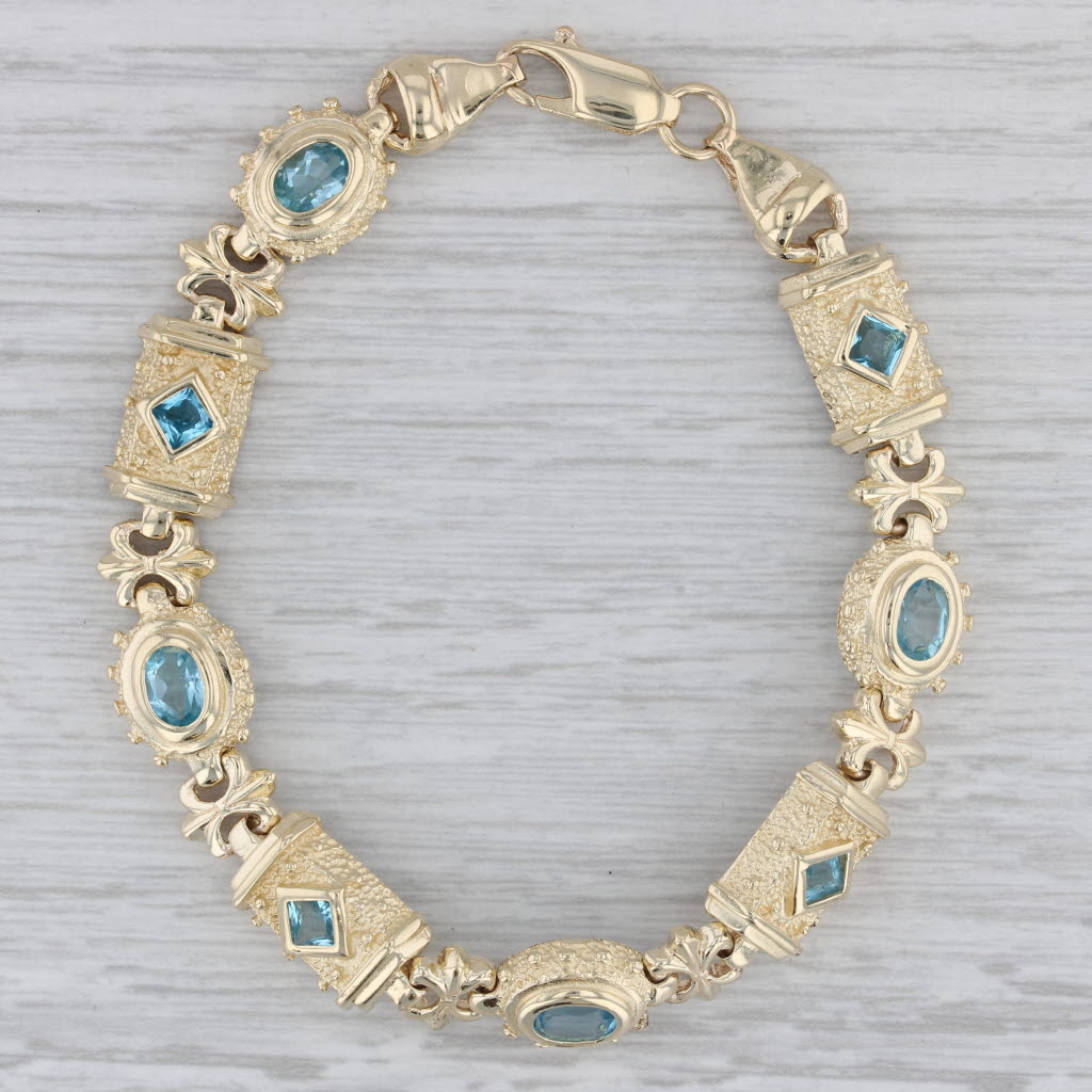 Gray 3ctw Blue Topaz Ornate Bracelet 14k Yellow Gold 7.25" 10.4mm