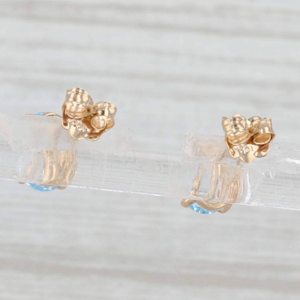 Light Gray 2ctw Oval Blue Topaz Solitaire Stud Earrings 14k Yellow Gold