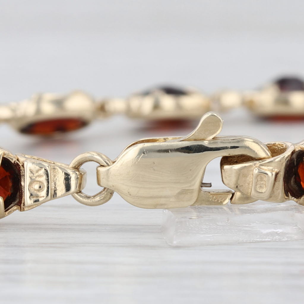 13ctw Garnet Tennis Bracelet 10k Yellow Gold 7" 6.3mm Oval Links