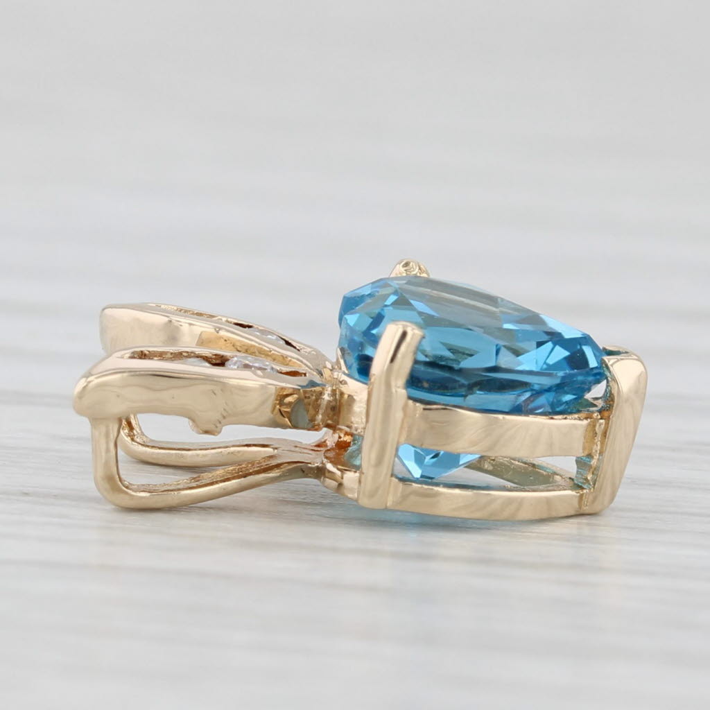 Light Gray 2.38ctw Blue Topaz Heart Diamond Pendant 14k Yellow Gold
