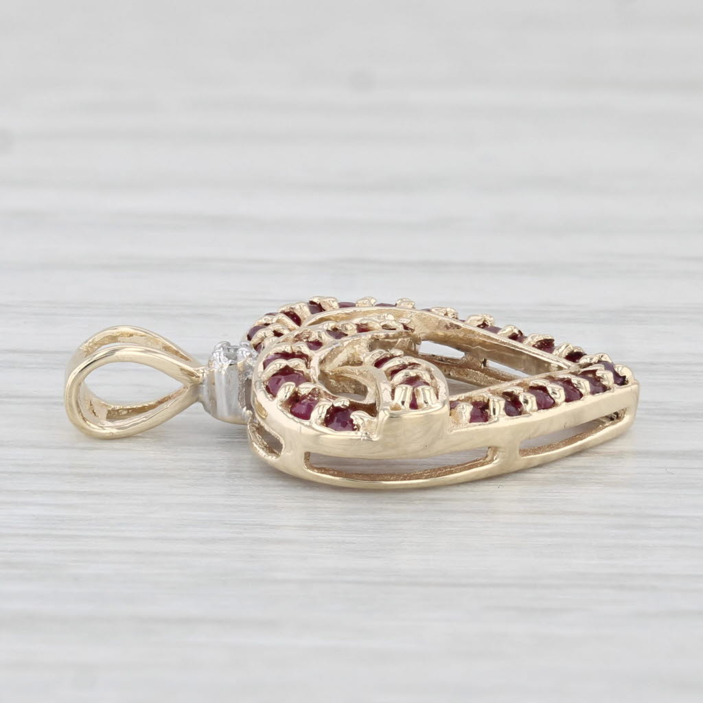 Light Gray 0.44ctw Ruby Diamond Knotted Heart Pendant 10k Yellow Gold