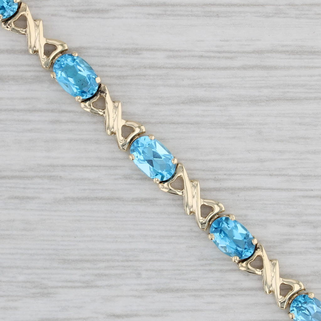 Gray 7.10ctw Blue Topaz Tennis Bracelet 10k Yellow Gold 6.75" 4.3mm