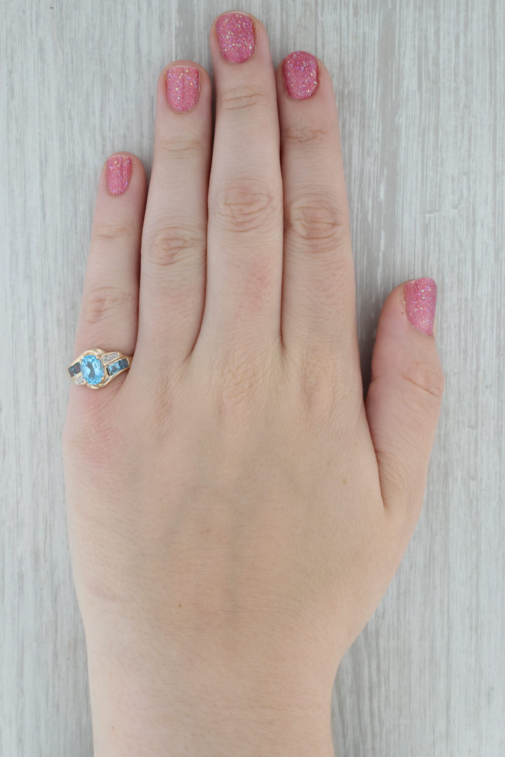 Dark Gray 2.30ctw Oval Blue Topaz Bypass Ring 10k Yellow Gold Size 7.25 Diamond Accents