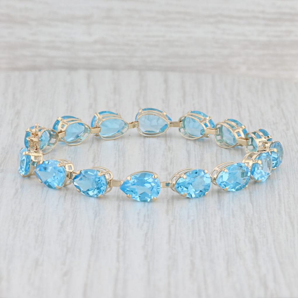 Light Gray 35ctw Blue Topaz Tennis Bracelet 14k Yellow Gold 7" 7mm