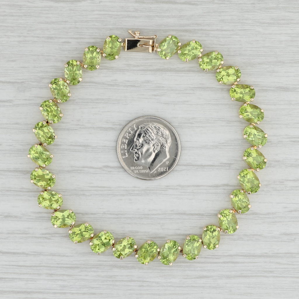 Light Gray 22.40ctw Peridot Tennis Bracelet 14k Yellow Gold 7.25" 7.3mm