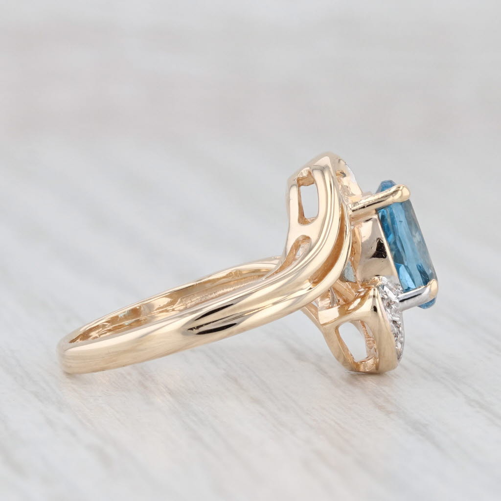 Light Gray 1.51ctw Oval Blue Topaz Diamond Bypass Ring 14k Yellow Gold Size 4.5