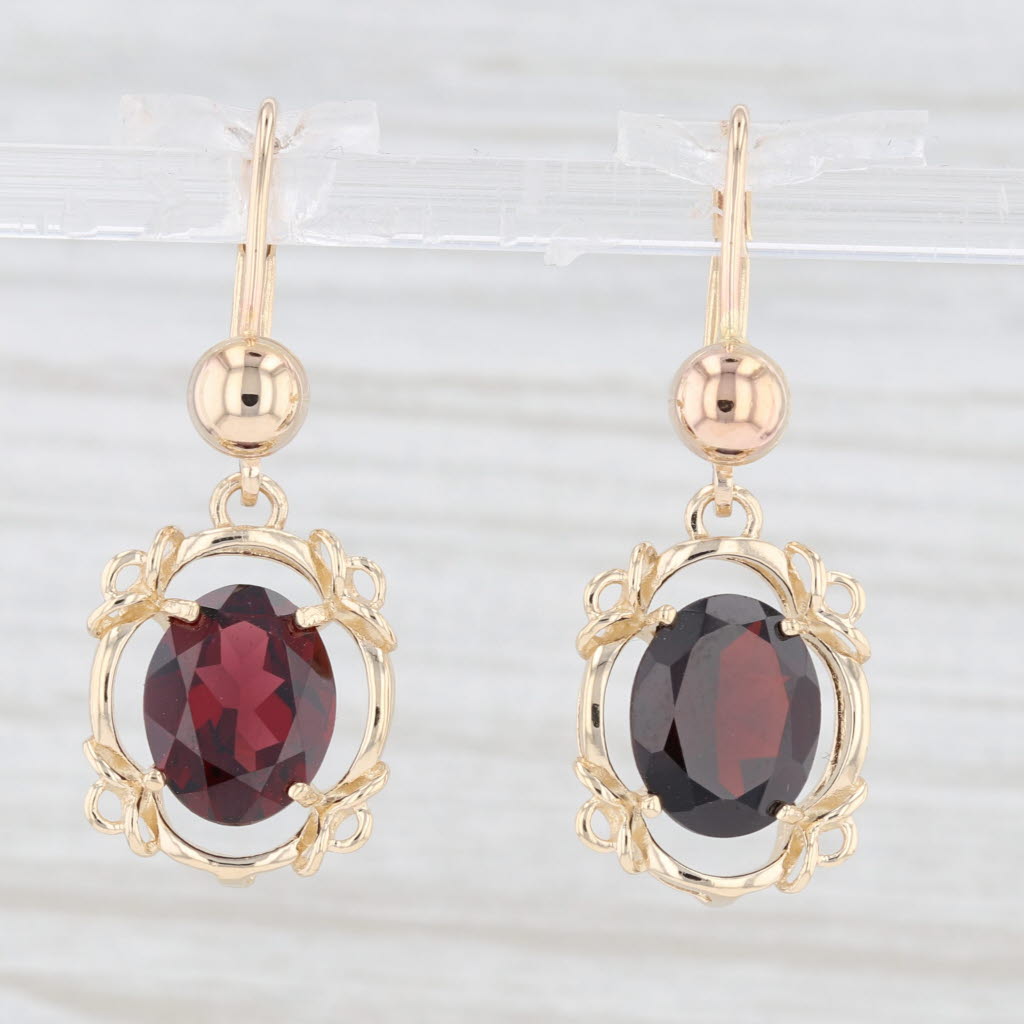Light Gray 5.30ctw Garnet Oval Dangle Earrings 14k Yellow Gold January Birthstone