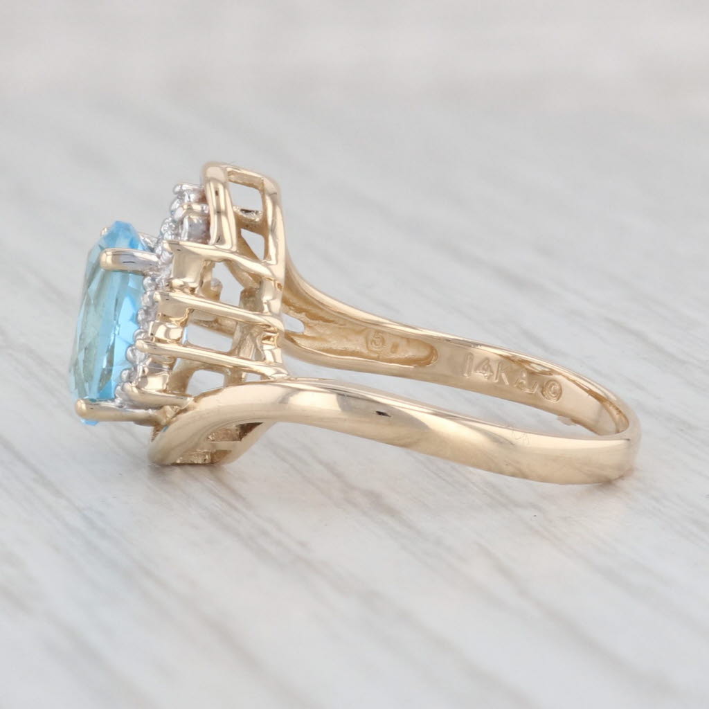 Light Gray 2.38ctw Blue Topaz Diamond Bypass Ring 14k Yellow Gold Size 6.75