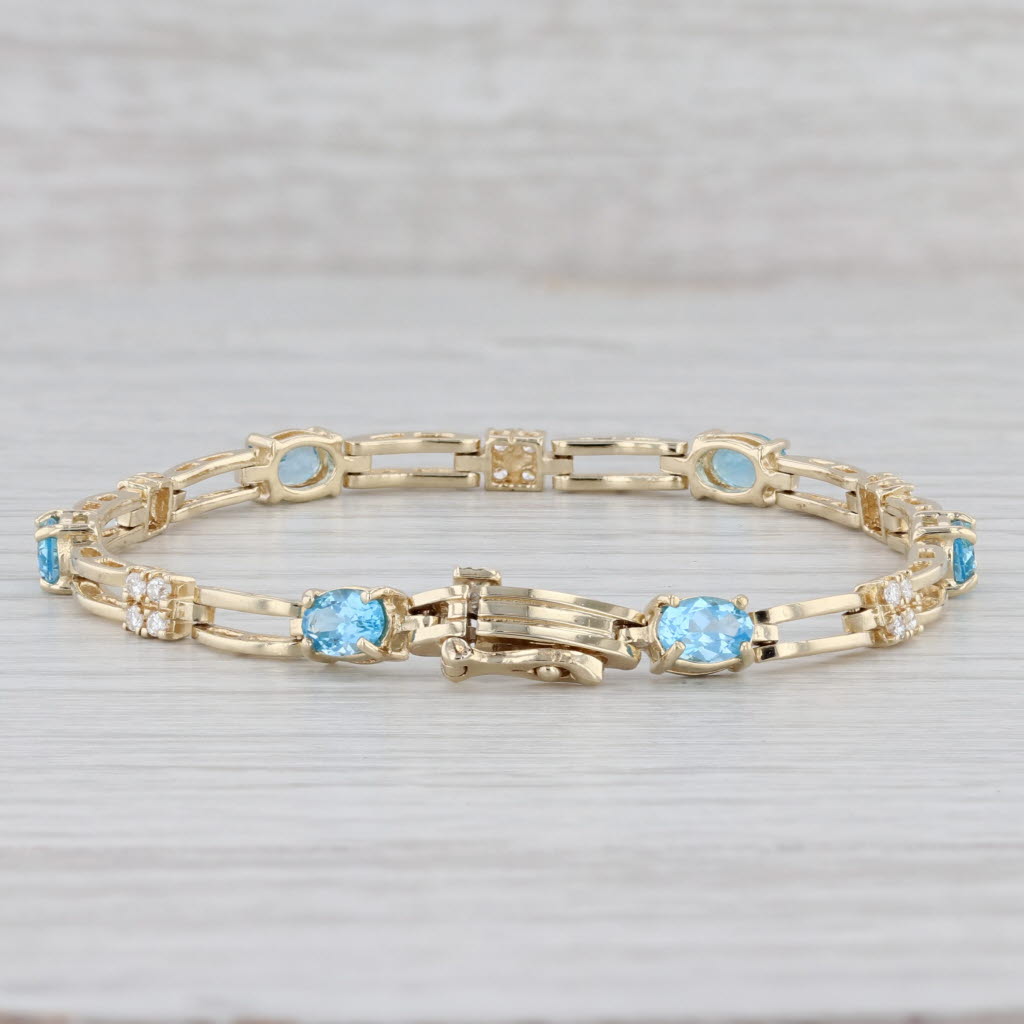Gray 3.82ctw Oval Blue Topaz Diamond Tennis Bracelet 14k Yellow Gold 6.75" 4.5mm