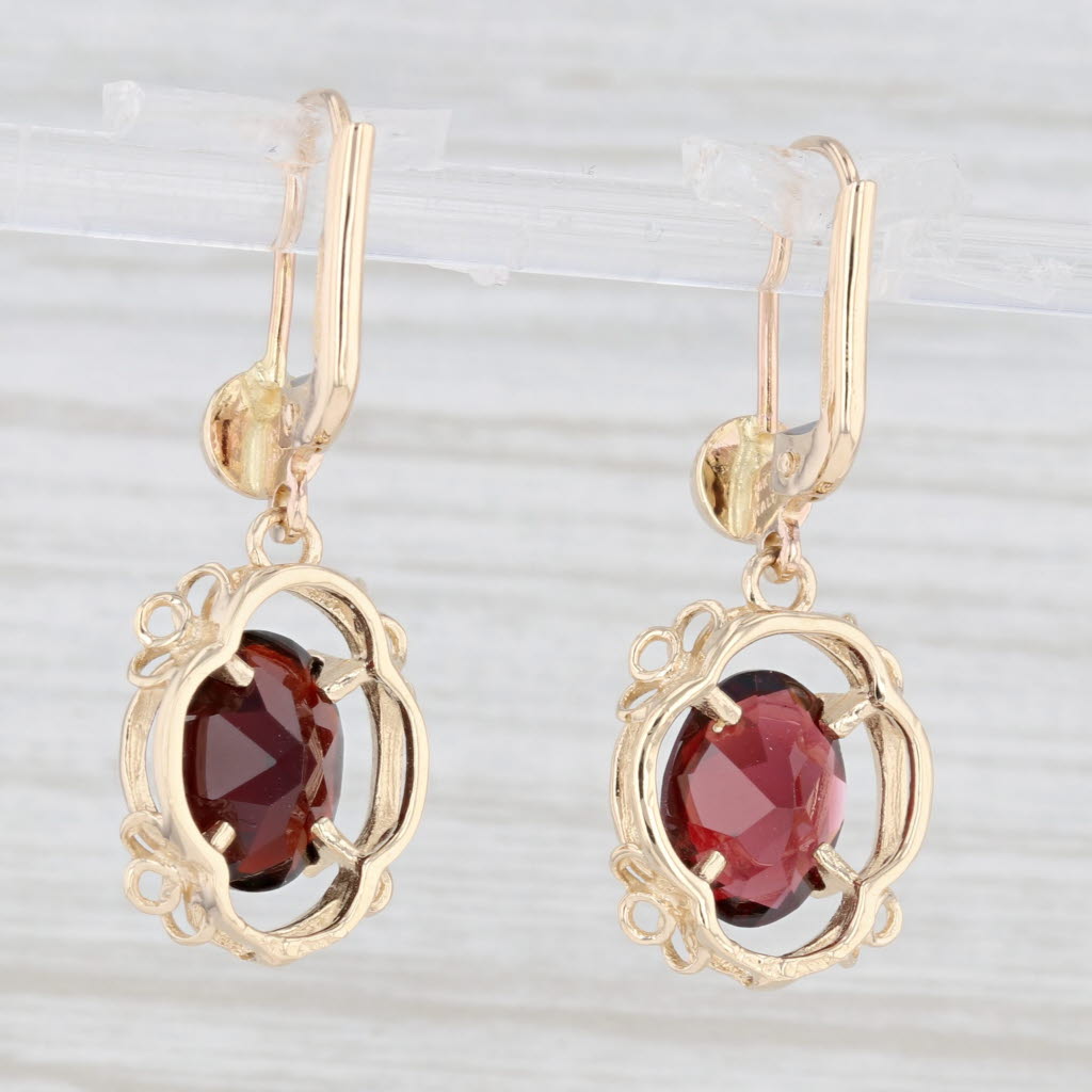 Light Gray 5.30ctw Garnet Oval Dangle Earrings 14k Yellow Gold January Birthstone