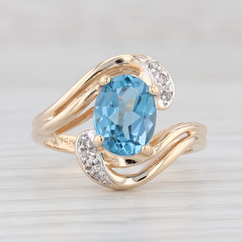 Light Gray 1.51ctw Oval Blue Topaz Diamond Bypass Ring 14k Yellow Gold Size 4.5