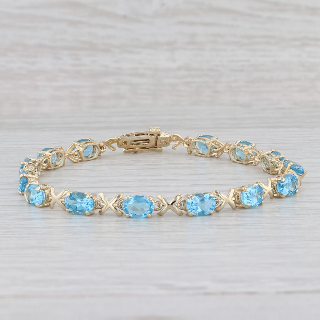 Light Gray 11.20ctw Oval Blue Topaz Tennis Bracelet 14k Yellow Gold 8" 5.2mm
