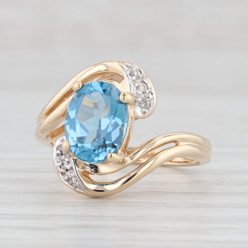 Light Gray 1.51ctw Oval Blue Topaz Diamond Bypass Ring 14k Yellow Gold Size 4.5