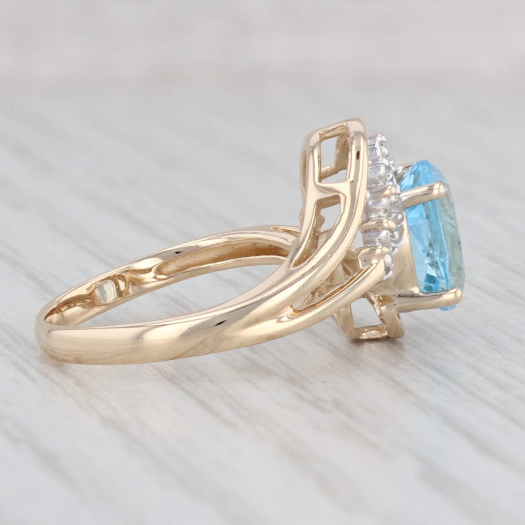 Light Gray 2.38ctw Blue Topaz Diamond Bypass Ring 14k Yellow Gold Size 6.75