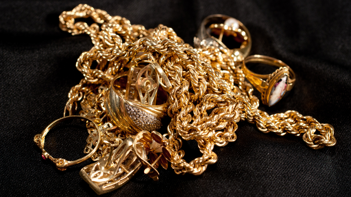 Gold estate jewelry collection including rings, chains, and vintage pieces.