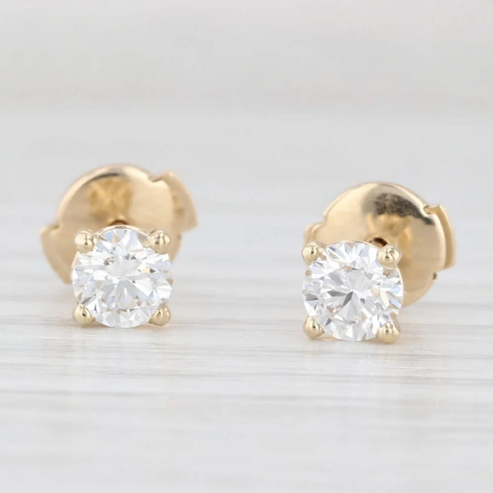 Round diamond stud earrings in yellow gold