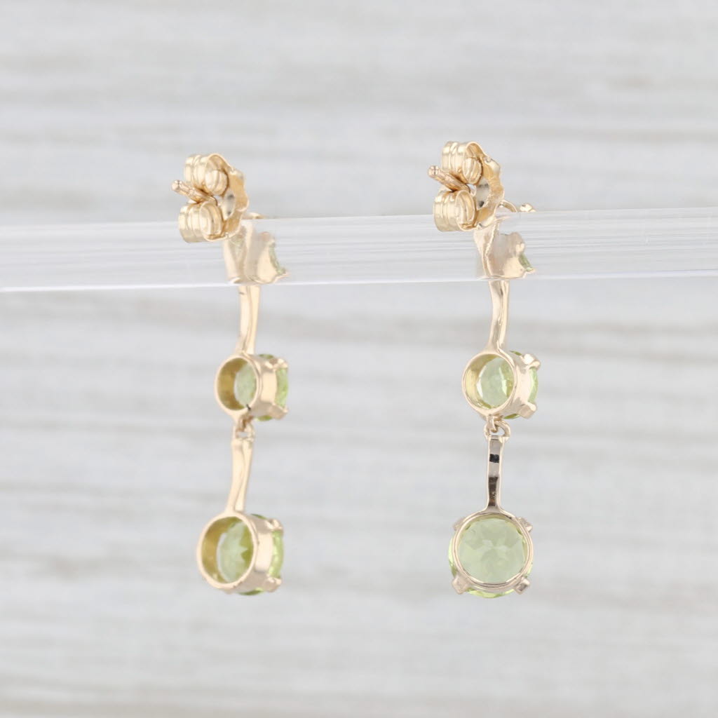 Light Gray 1.85ctw Peridot Graduated 3-Stone Dangle Earrings 10k Yellow Gold