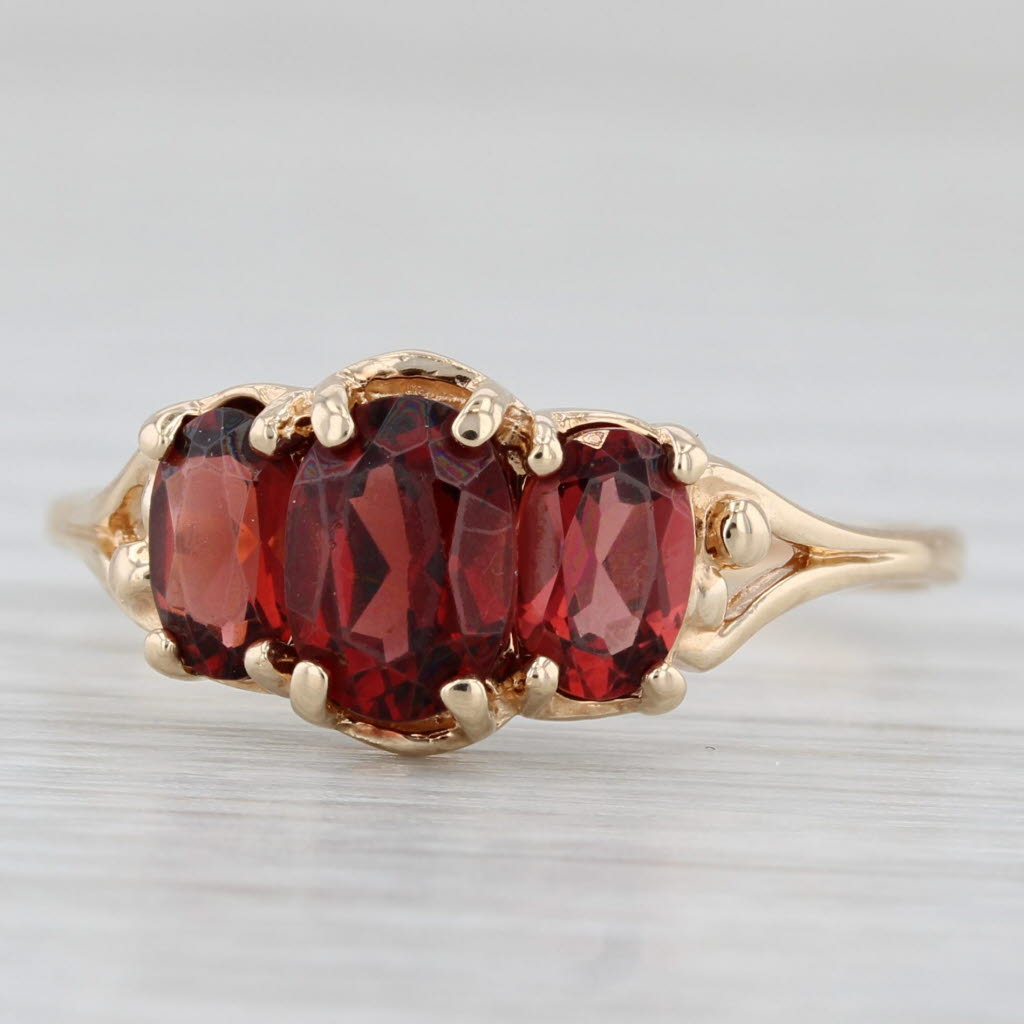 Light Gray 2.06ctw Oval 3-Stone Garnet Ring 10k Yellow Gold Size 9.5