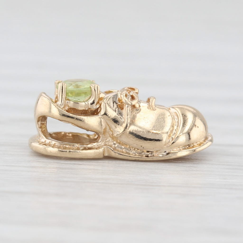 Light Gray 0.12ct Peridot Solitaire Baby Shoe 10k Yellow Gold August Birthstone
