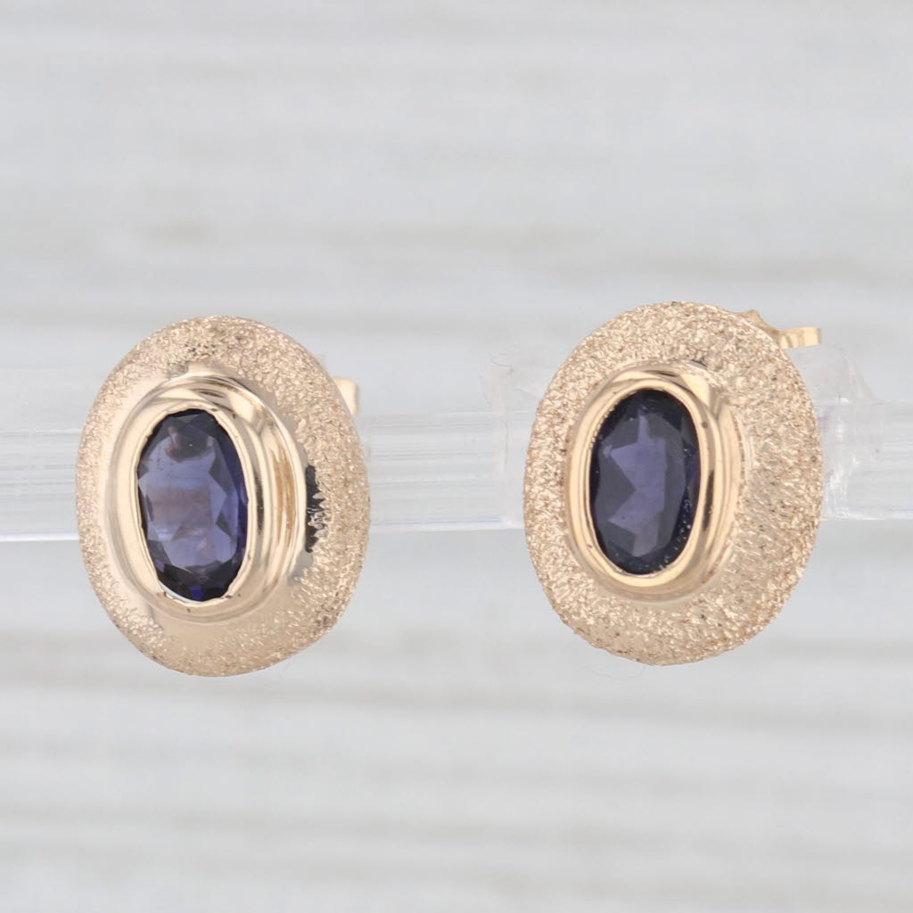 Light Gray 0.75ctw Oval Blue Iolite Stud Earrings 14k Yellow Gold