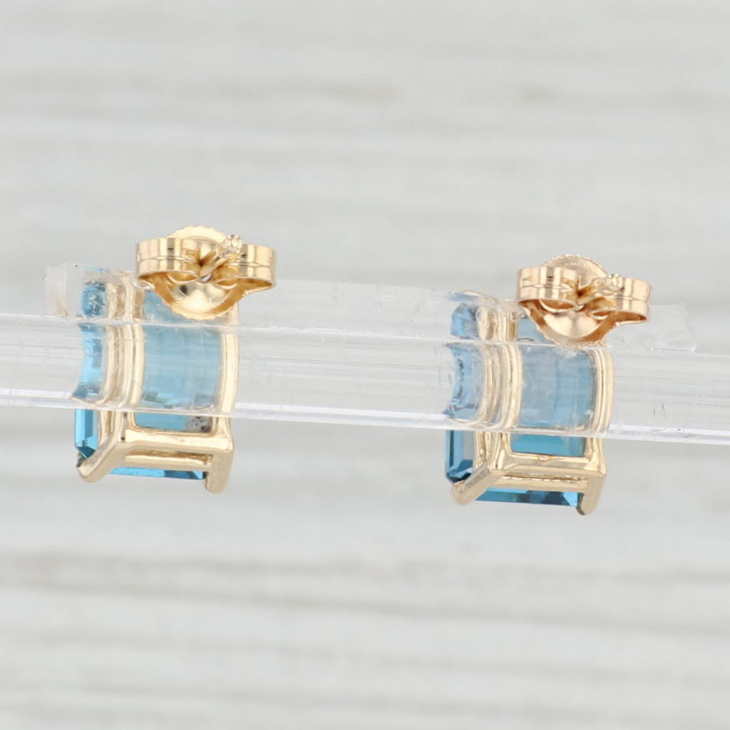 Light Gray 6ctw London Blue Topaz Solitaire Stud Earrings 14k Yellow Gold Emerald Cut Studs