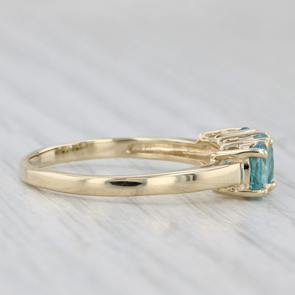 Light Gray 0.90ctw Oval 3-Stone Blue Zircon Ring 10k Yellow Gold Size 7