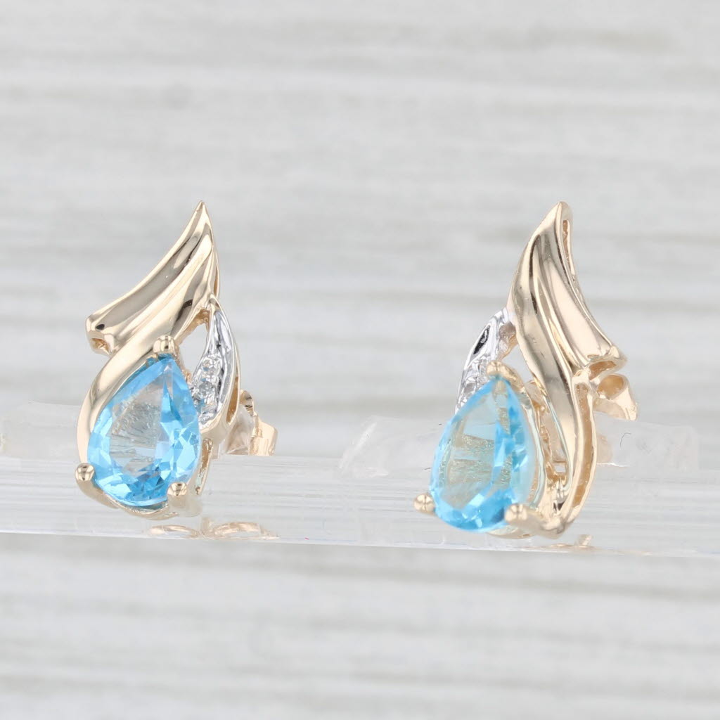 Light Gray 1.60ctw Pear Blue Topaz Diamond Stud Earrings 10k Yellow Gold Diamond Accents