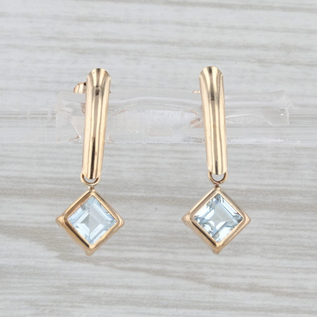 1.14ctw Blue Topaz Dangle Earrings 10k Yellow Gold Pierced Drops