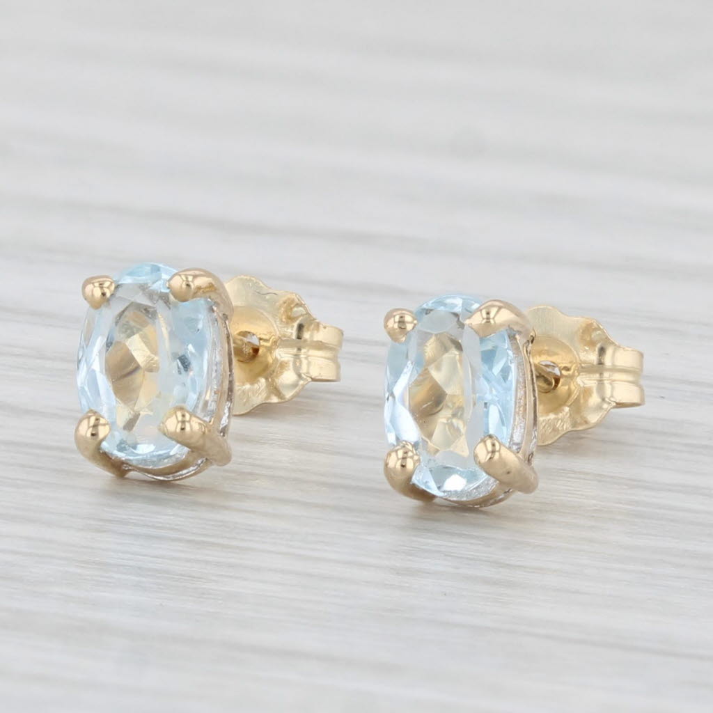 Light Gray 0.80ctw Aquamarine Stud Earrings 14k Yellow Gold Oval Solitaires