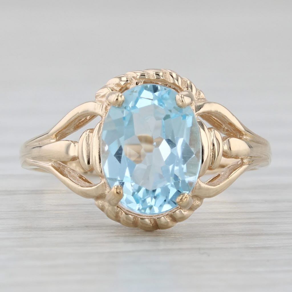 Light Gray 2.15ctw Oval Blue Topaz Solitaire Ring 10k Yellow Gold Size 6.5