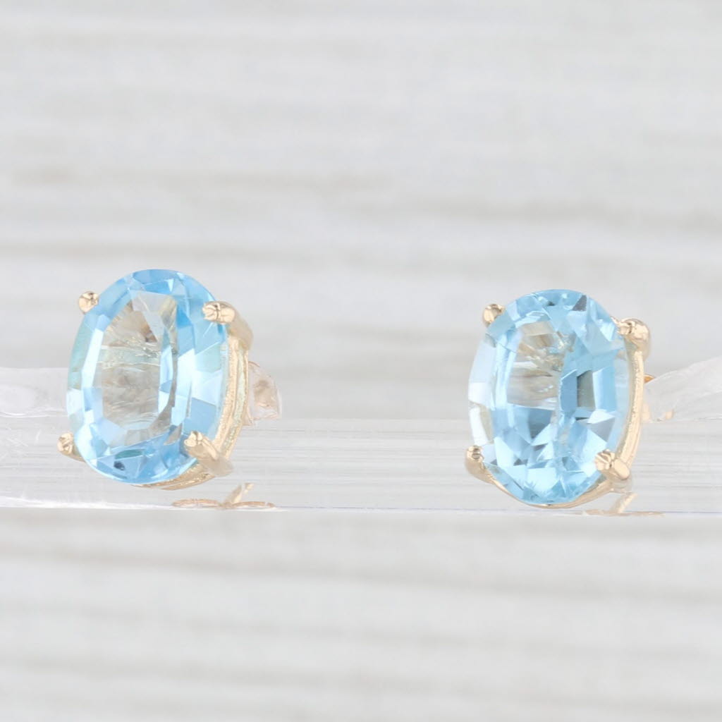 Light Gray 6.60ctw Oval Blue Topaz Solitaire Stud Earrings 14k Yellow Gold