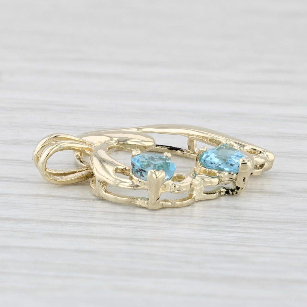Light Gray 0.60ctw Blue Topaz Hearts Open Heart Pendant 10k Yellow Gold