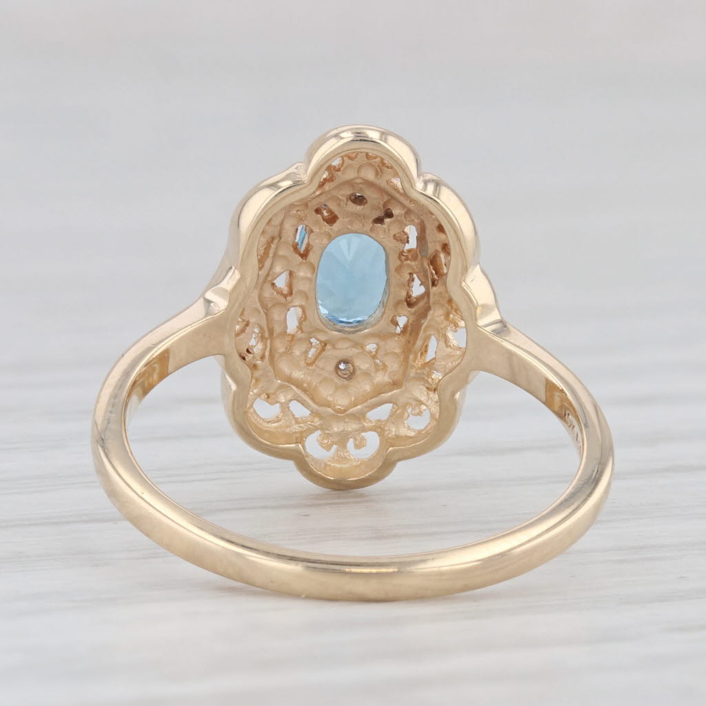 Light Gray 0.60ct Oval Blue Topaz Ring 10k Yellow Gold Size 6 Diamond Accents