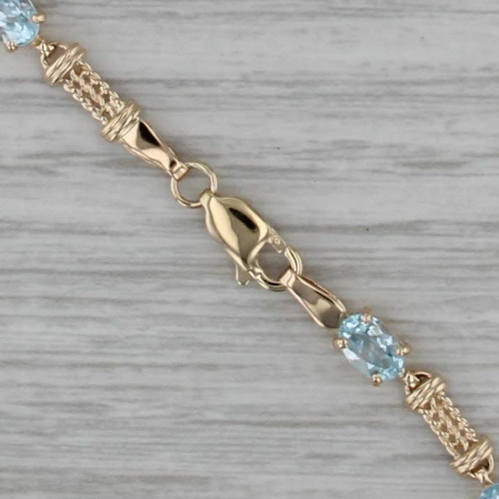 5.10ctw Blue Topaz Tennis Bracelet 10k Yellow Gold 7" 4.3mm