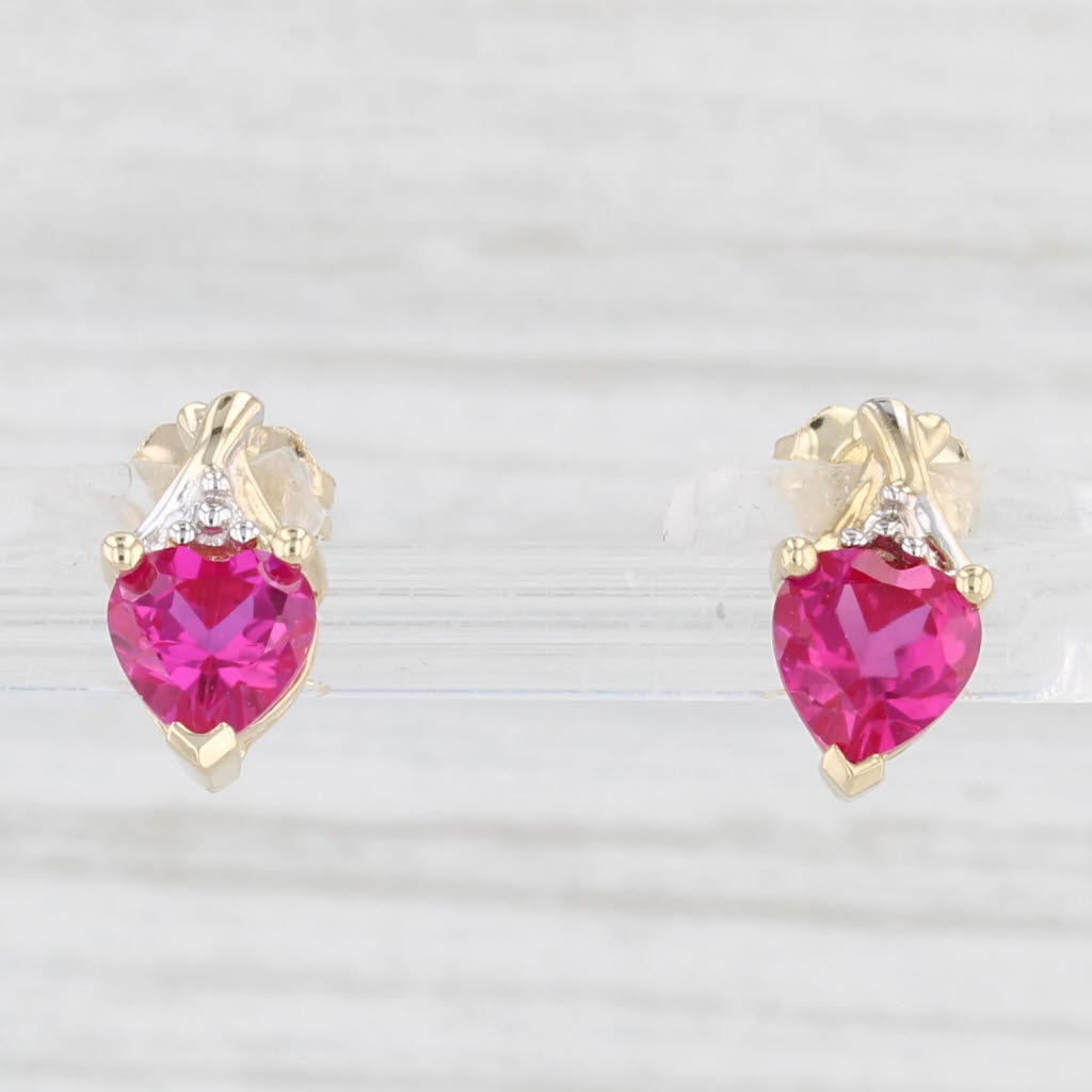 Light Gray 1.20ctw Lab Created Ruby Heart Stud Earrings 10k Yellow Gold