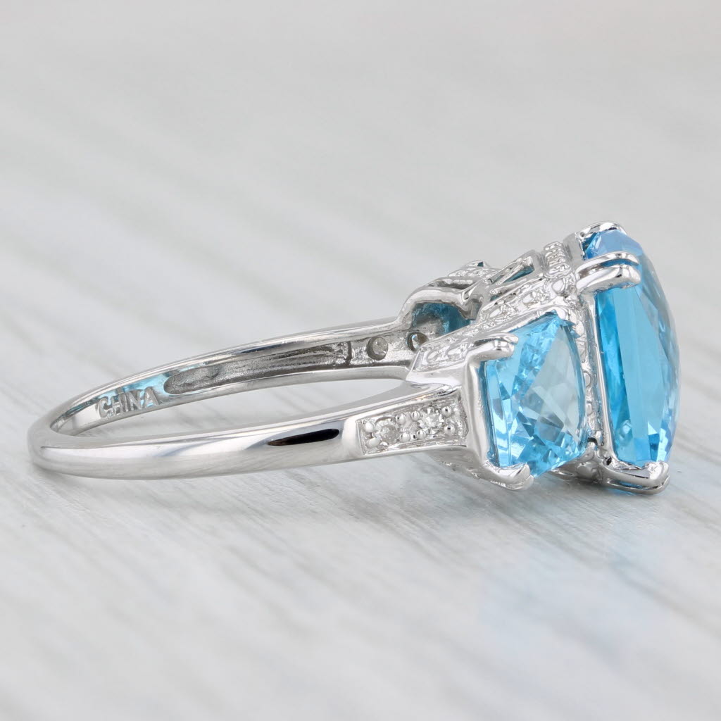 Light Gray 6.37ctw Blue Topaz 3-Stone Ring 10k White Gold Size 7 Diamond Accents