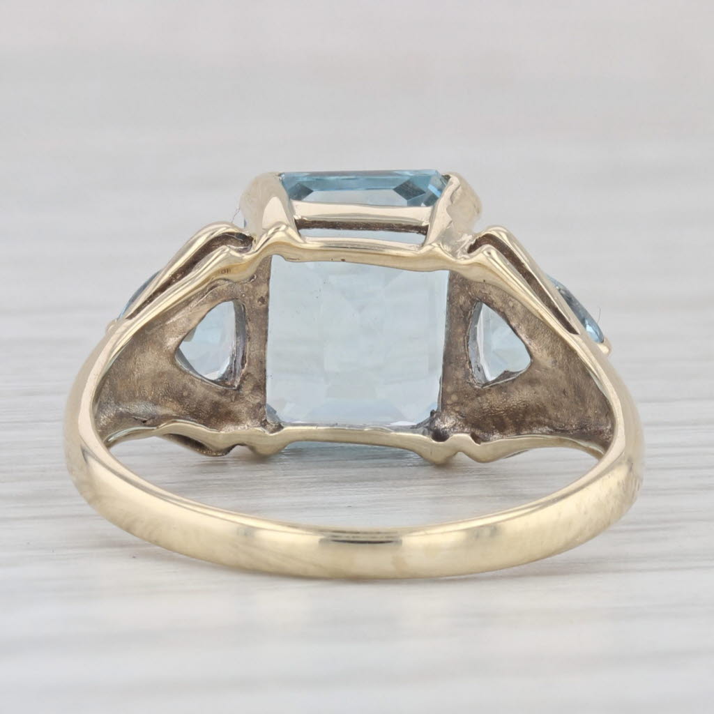 Light Gray 5.50ctw Emerald Cut Blue Topaz Ring 10k Yellow Gold Size 7