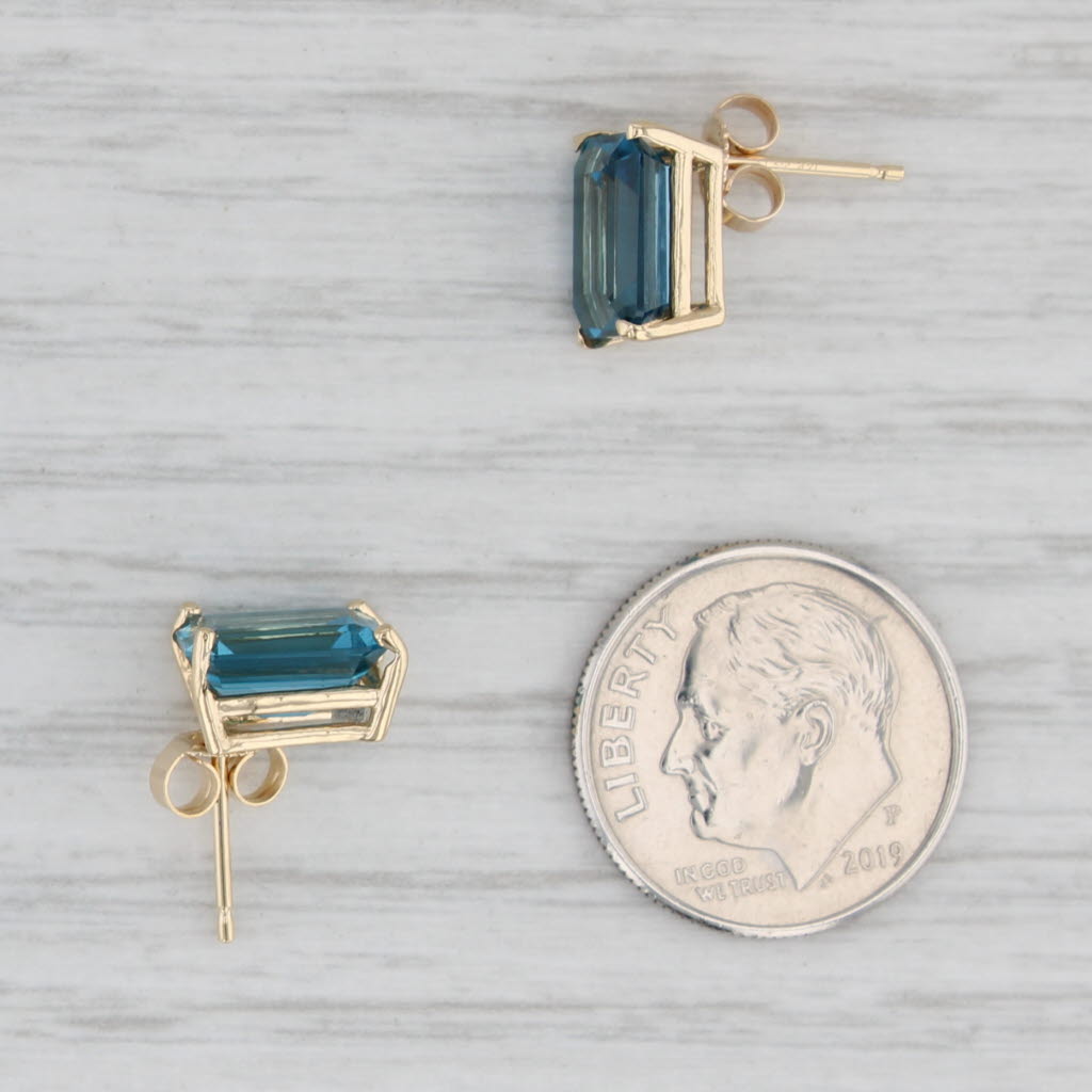 Light Gray 6ctw London Blue Topaz Solitaire Stud Earrings 14k Yellow Gold Emerald Cut Studs