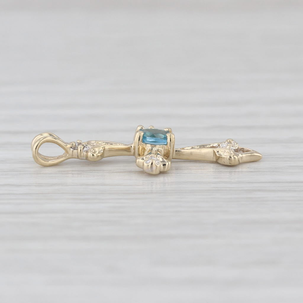 0.16ct Blue Topaz Cross Pendant 14k Yellow Gold Diamond Accents