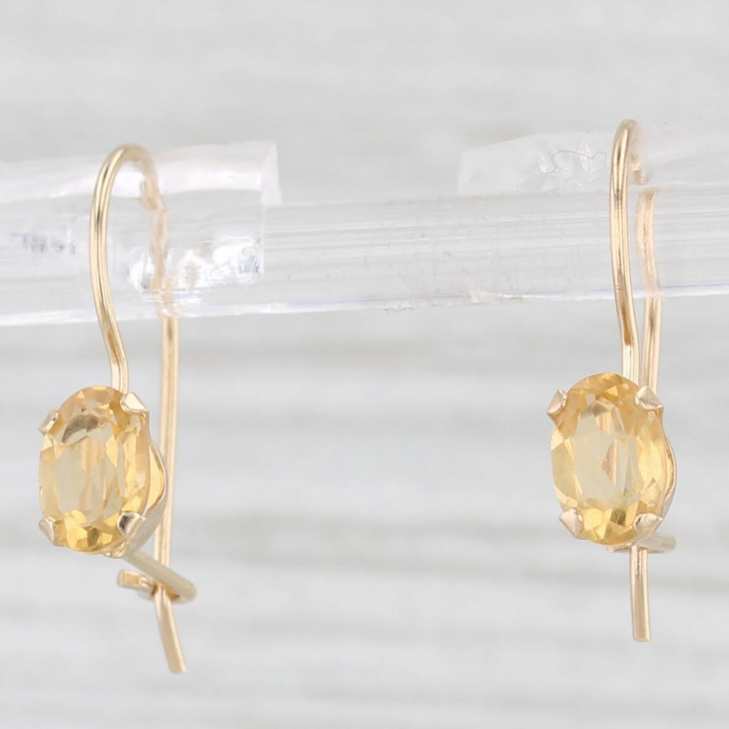 Light Gray 0.80ctw Oval Solitaire Citrine Drop Earrings 14k Yellow Gold Hook Posts