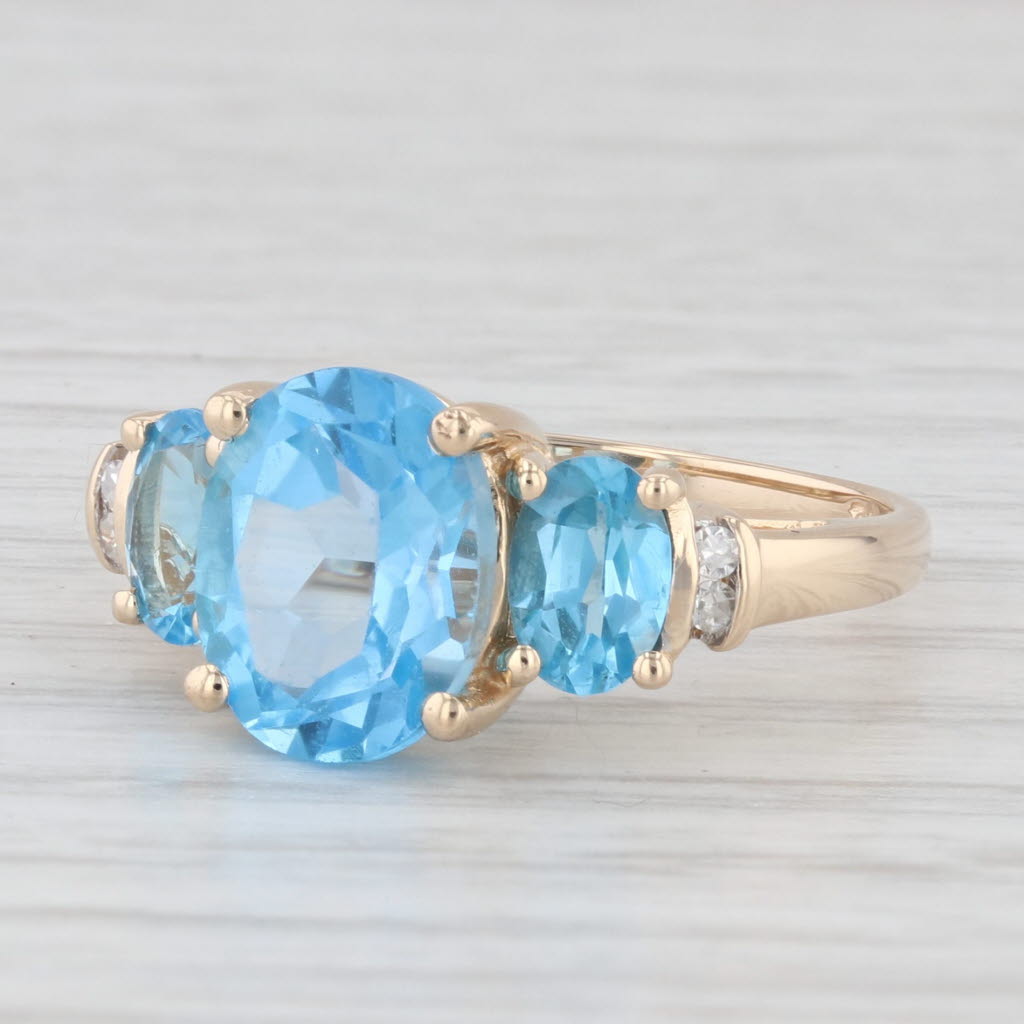 Light Gray 4.48ctw Oval Blue Topaz Ring 14k Yellow Gold Diamond Accents Size 7