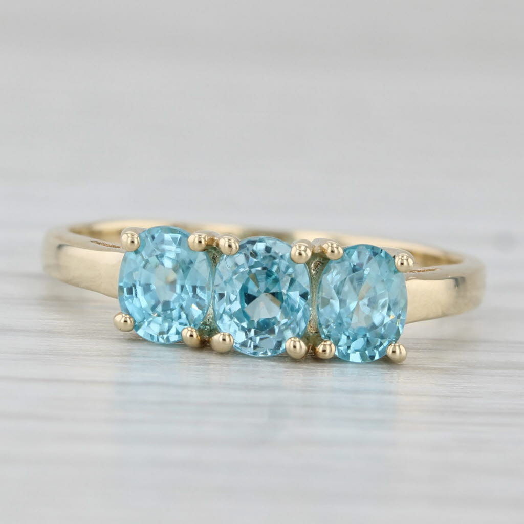 Light Gray 0.90ctw Oval 3-Stone Blue Zircon Ring 10k Yellow Gold Size 7