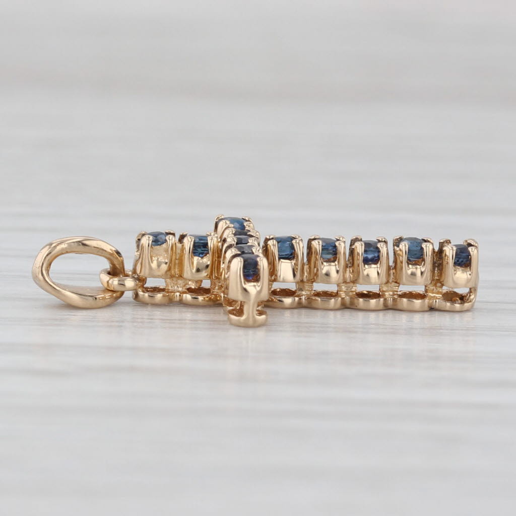 Light Gray 0.30ctw Blue Sapphire Cross Pendant 14k Yellow Gold