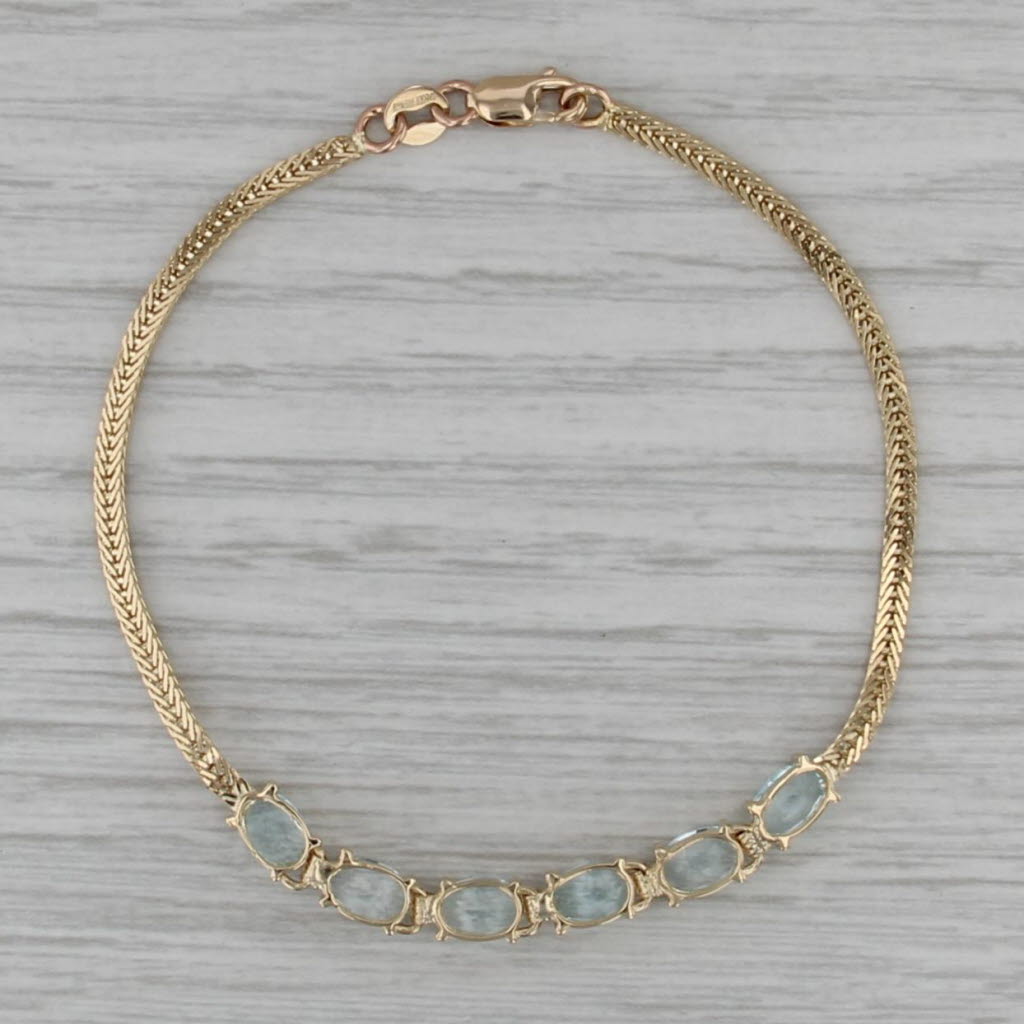 3.10ctw Blue Topaz Bracelet 14k Yellow Gold 6.5" Herringbone Chain