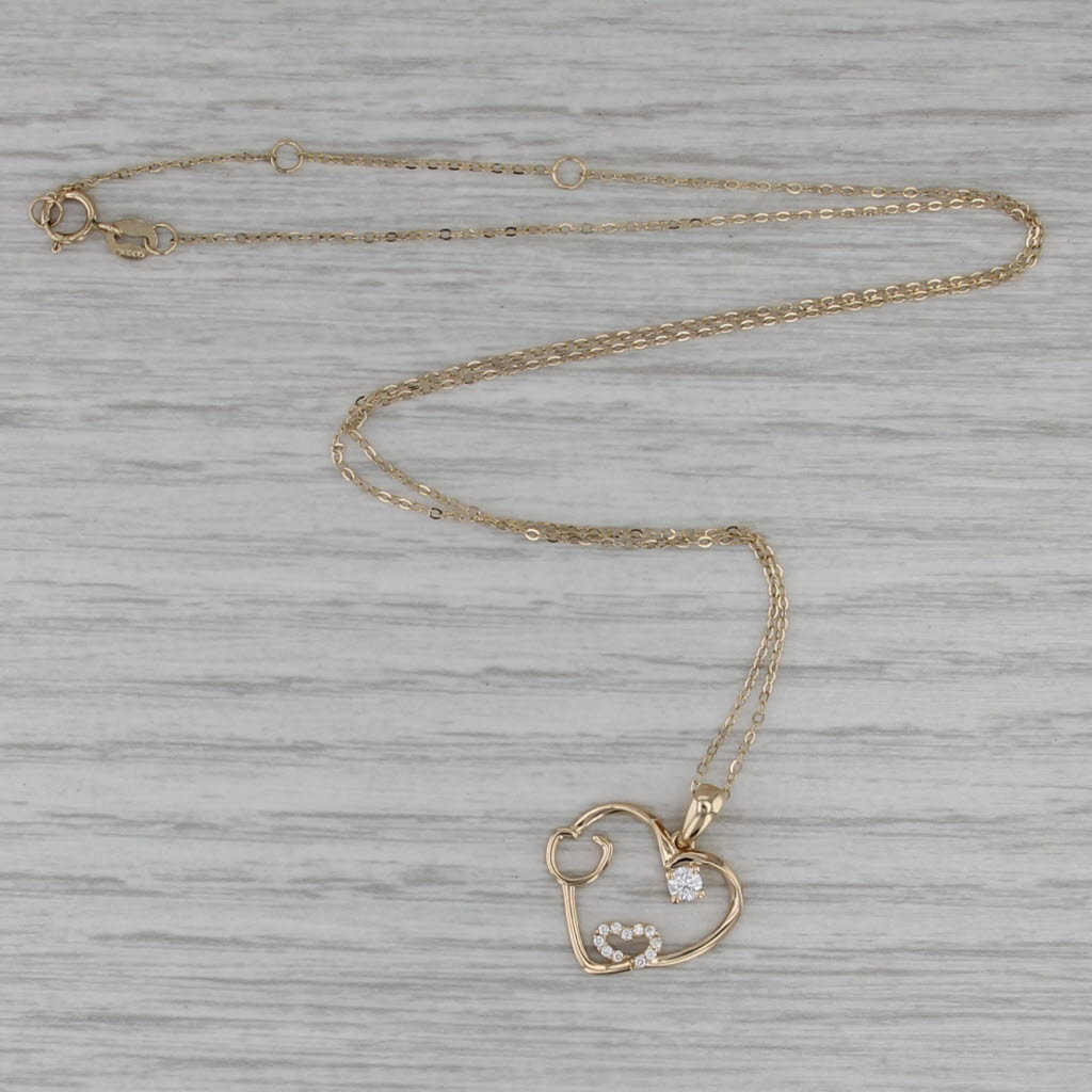 0.15ctw Moissanite Stethascope Heart Pendant 14k Yellow Gold 16-18" Cable Chain