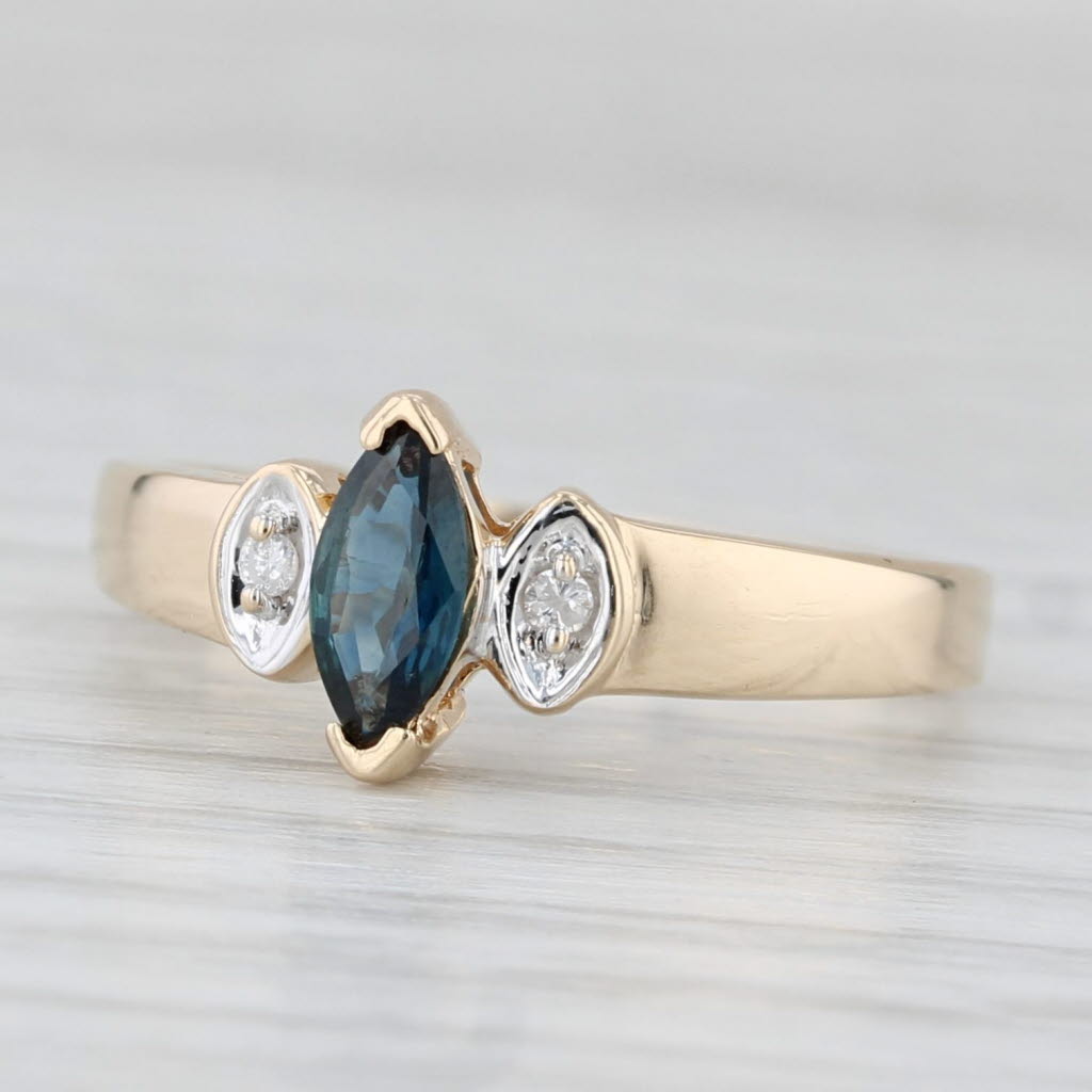 Light Gray 0.34ctw Marquise Blue Sapphire Diamond Ring 10k Yellow Gold Diamond Accents