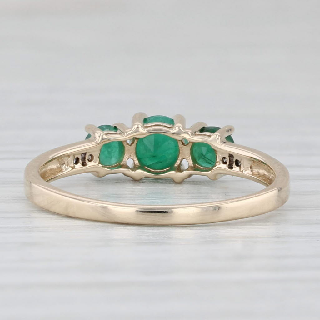 Light Gray 0.68ctw Emerald Round 3-Stone Ring 10k Yellow Gold Size 7 Diamond Accents