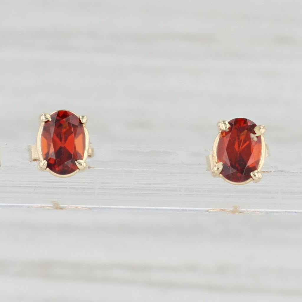 Light Gray 1.20ctw Oval Garnet Stud Earrings 14k Yellow Gold January Birthstone