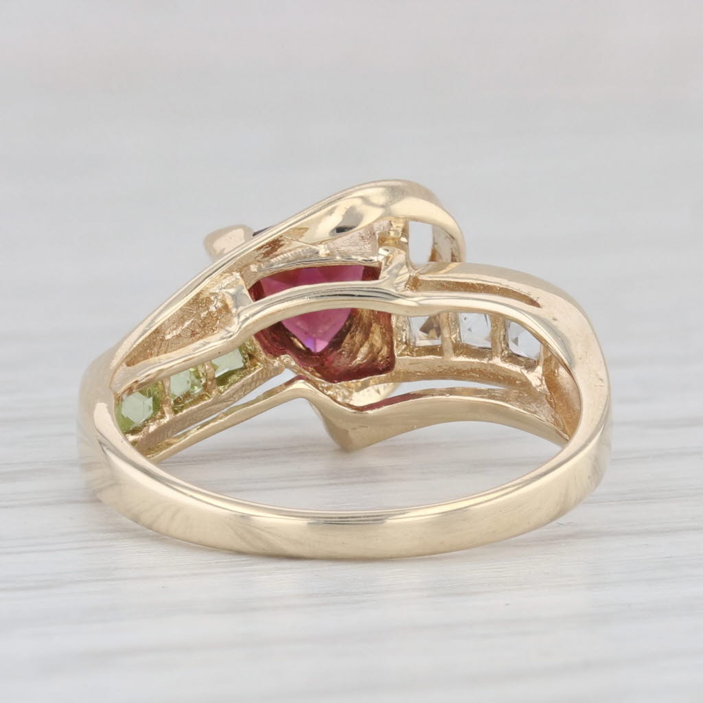 Light Gray 1.11ctw Garnet Peridot Topaz Bypass Ring 10k Yellow Gold Size 6.75