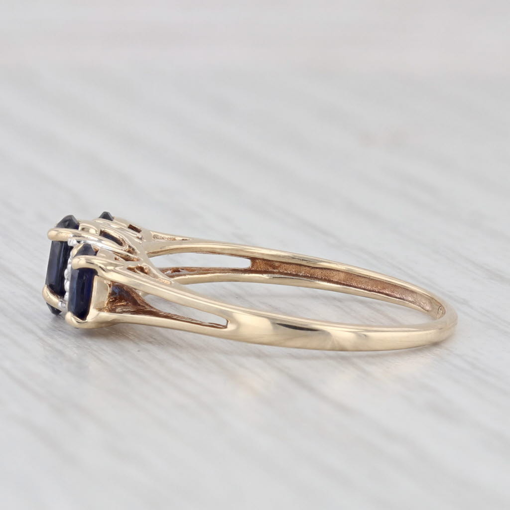 Light Gray 1.20ctw Lab Created Blue Sapphire 3-Stone Ring 10k Yellow Gold Size 7